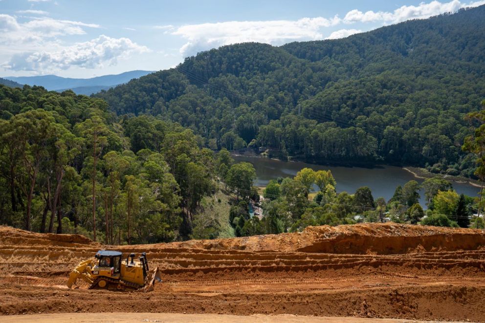 D8 Bulldozer pushes landslip material with Lake Guy in the distance 24 March