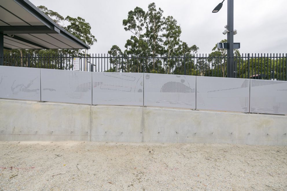 Aliminium sheeting featuring artwork design adjacent to the accessible pedestrian ramp 