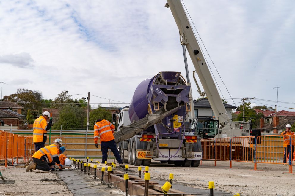 Workers concreting on site at Burwood.