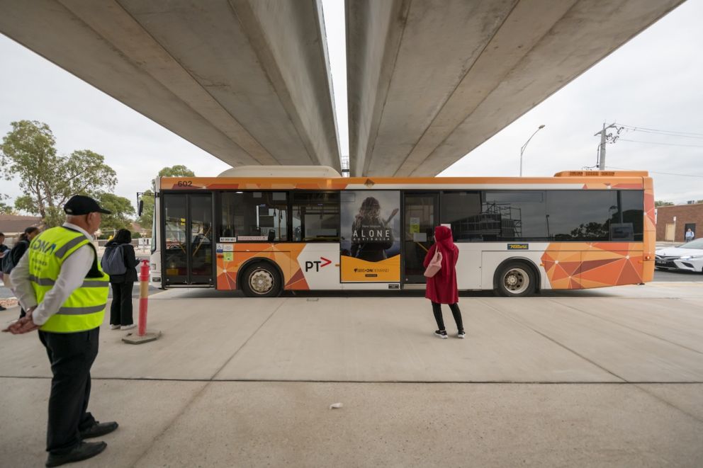 A bus under the new elevated rail line