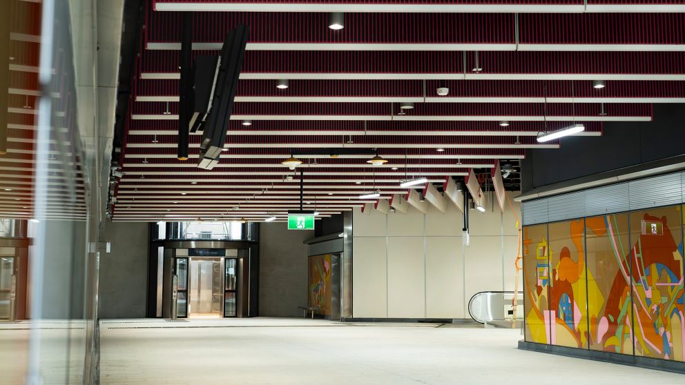 Anzac Station concourse with artwork on the walls