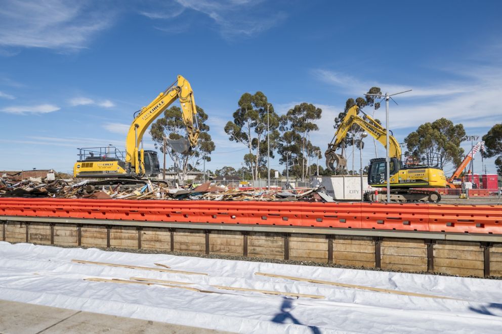 Excavators on the platform of Melton Station