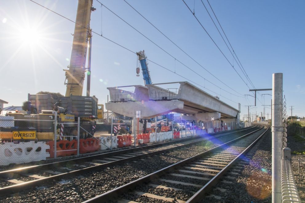 Two cranes lifting L-Beams at Aspendale