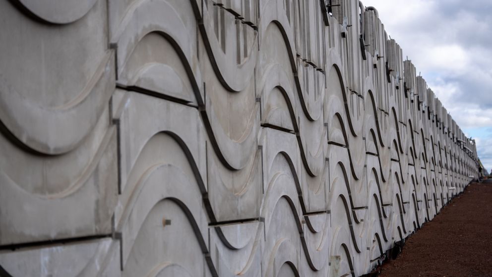 A total of 637 reinforced panels will make up the facade of the new retaining walls