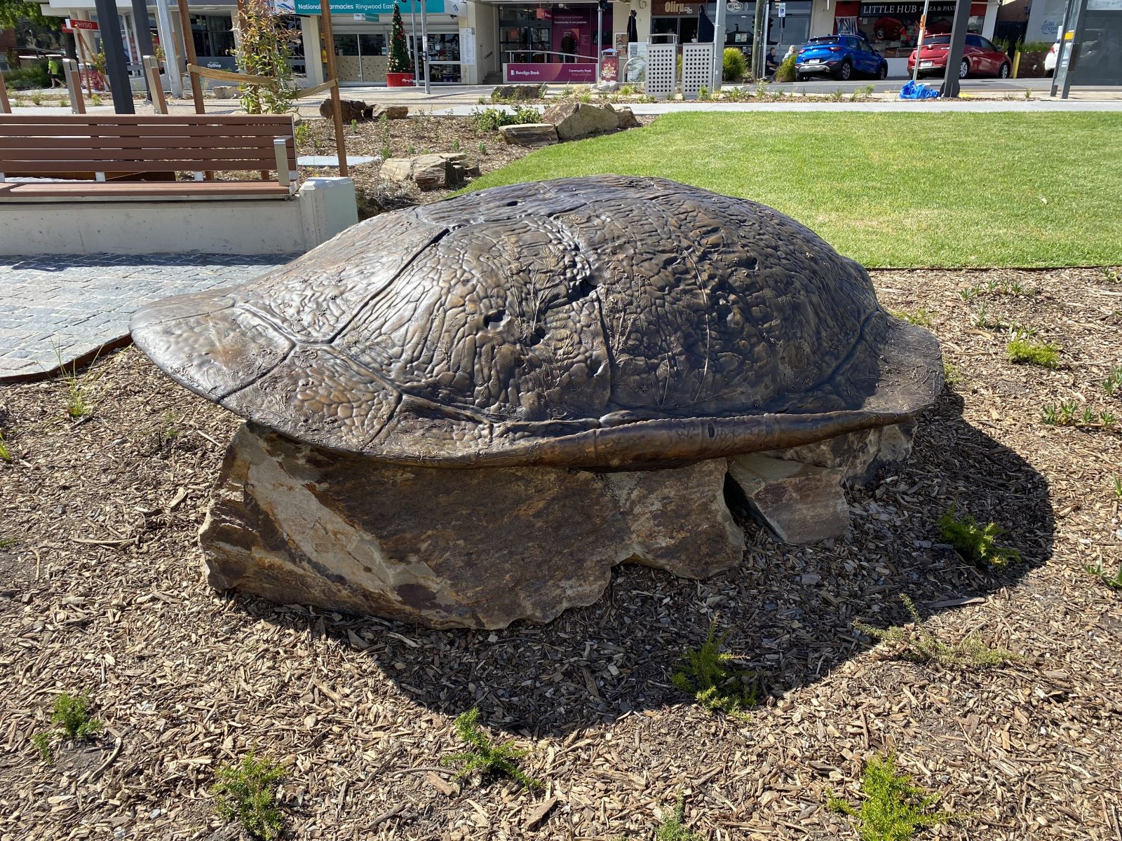 Turtle Guardian, a large turtle shell situated on a rock, in the Ringwood East Station forcourt