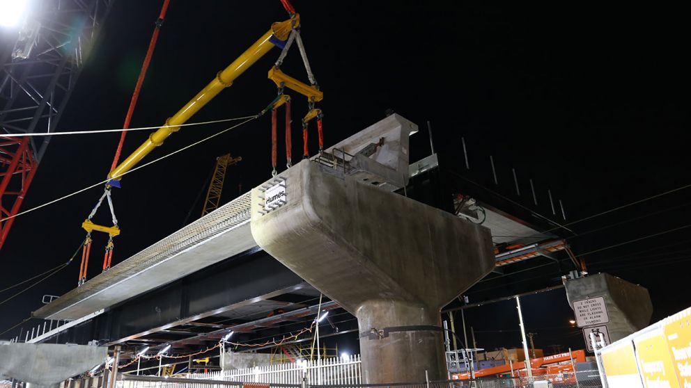 An L-beam is lifted into place