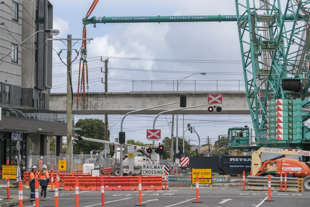 A level crossing free Keon Parade is one step closer with all 32 of the rail bridge beams now lifted into place