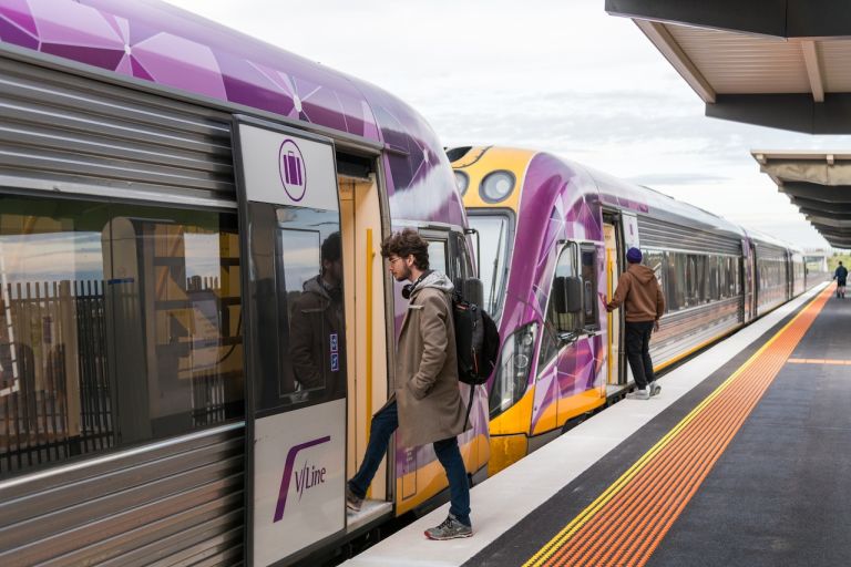 Passengers board a V Line train at the newly opened West Tarneit Station