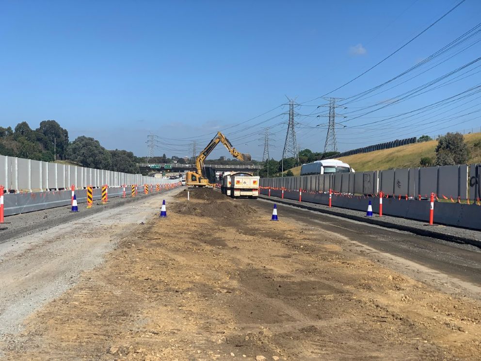 November 2020 We've removed 50,000 tonnes of soil from the freeway centre NOV median to prepare for new lanes. Image shows soil removal within the centre median with safety measures.