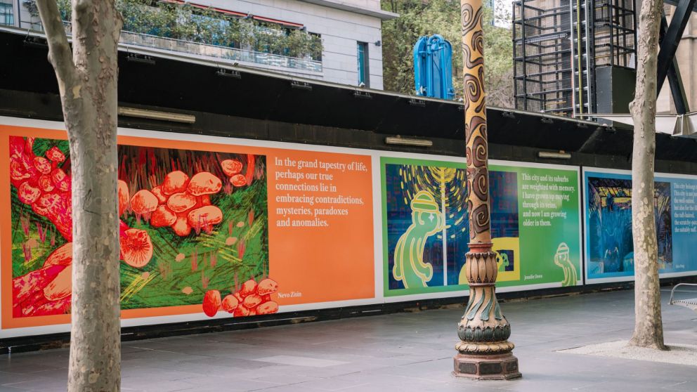 Wide angle image of artwork in City Square featured on the side of site construction hoardings.