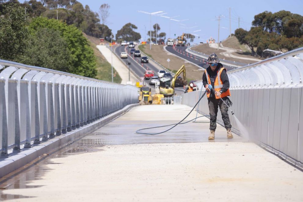 Cleaning the Jacksons Creek bridge ready to open to traffic