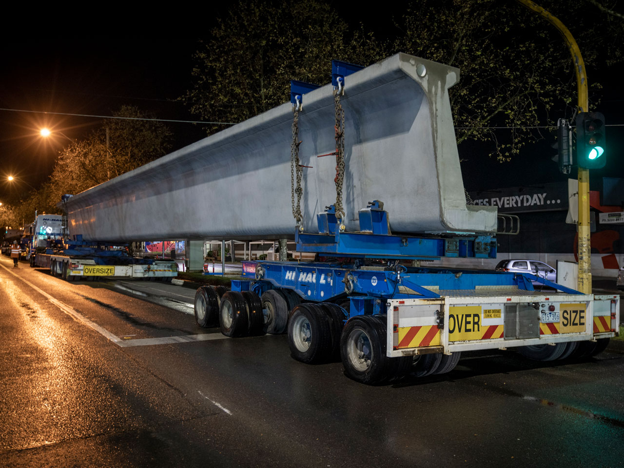 Concrete L Beam sitting on a truck at night.