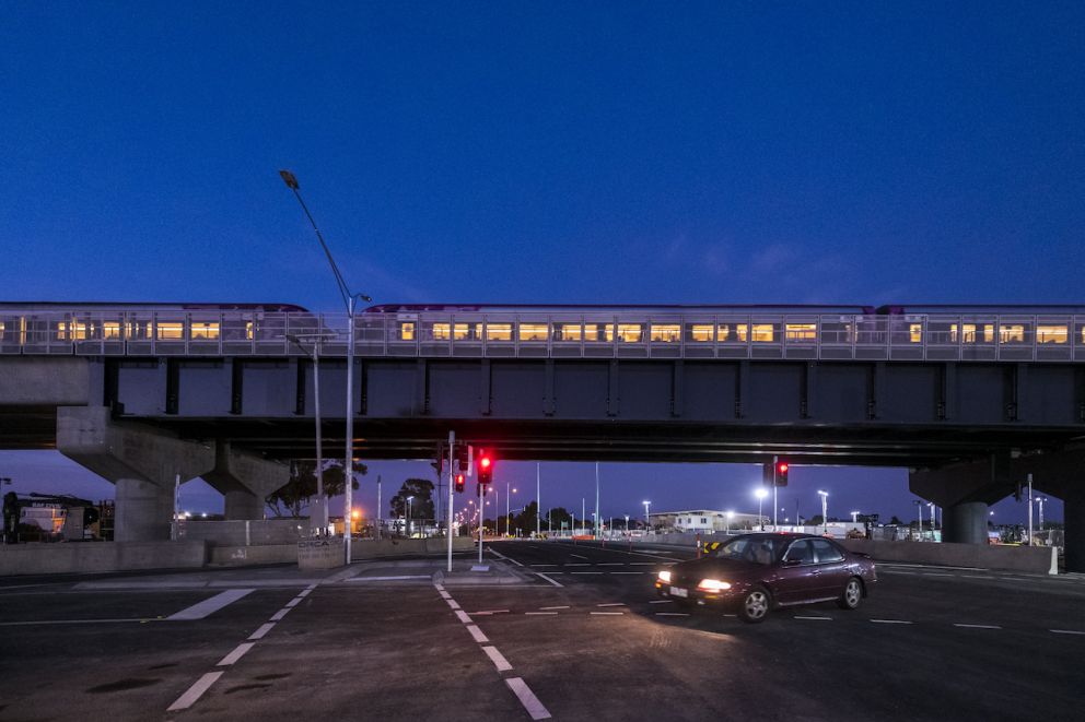 Trains pass over the newly reopened Mt Derrimut Road.