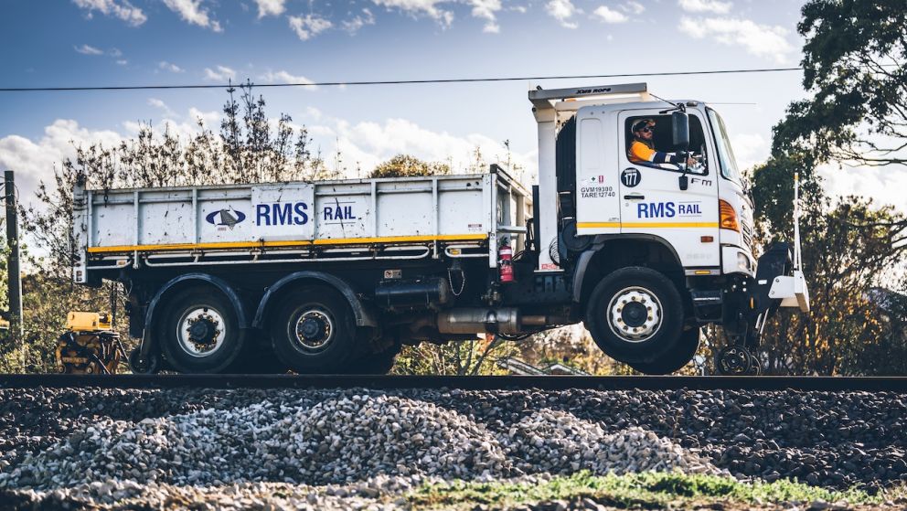 A high-rail truck transports equipment onto site during a construction blitz