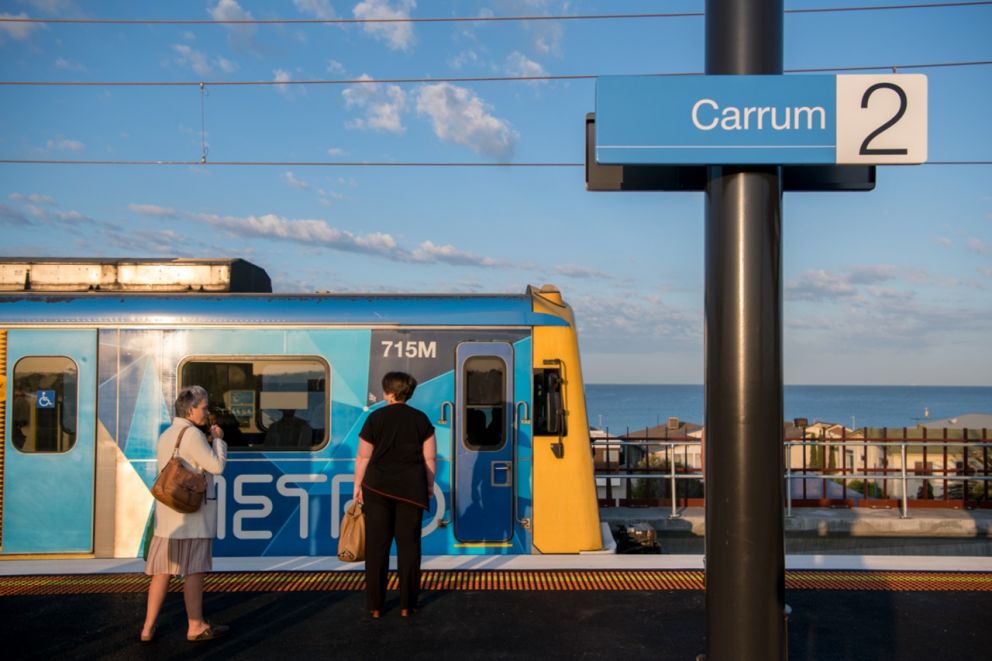 Commuters prepare to board the train at Carrum Station