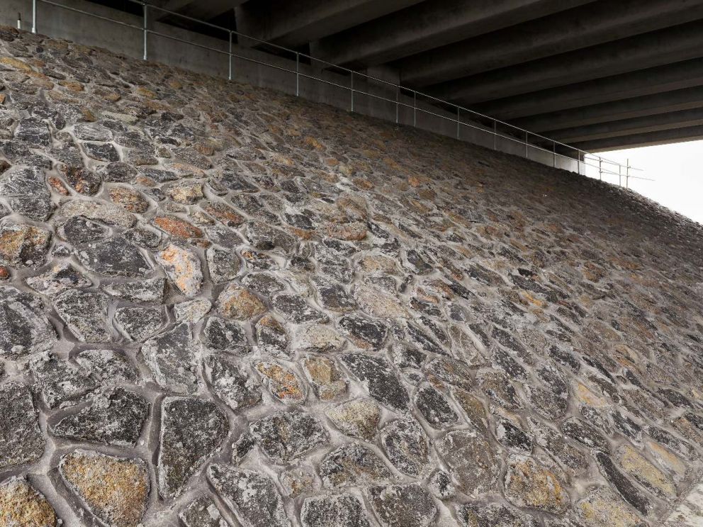 Rock embankment underneath the bridge over Governor Road