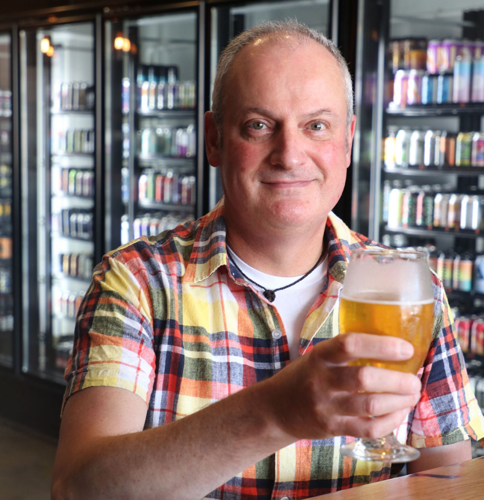 Craig, a lucky winner of the Friday Frenzy holding a beer.