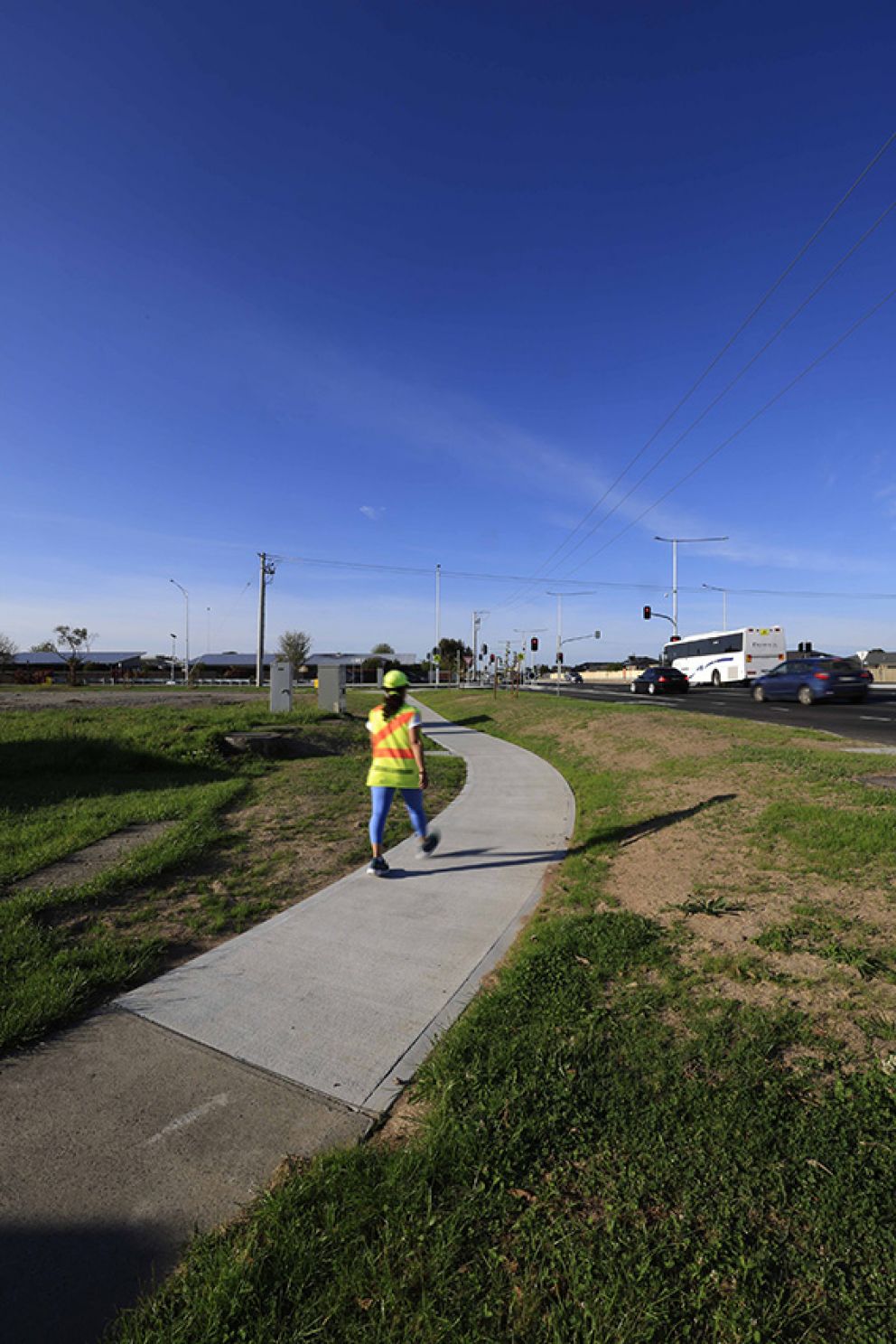 October 2024- The new footpath along McGregor Road, poured with coffee concrete