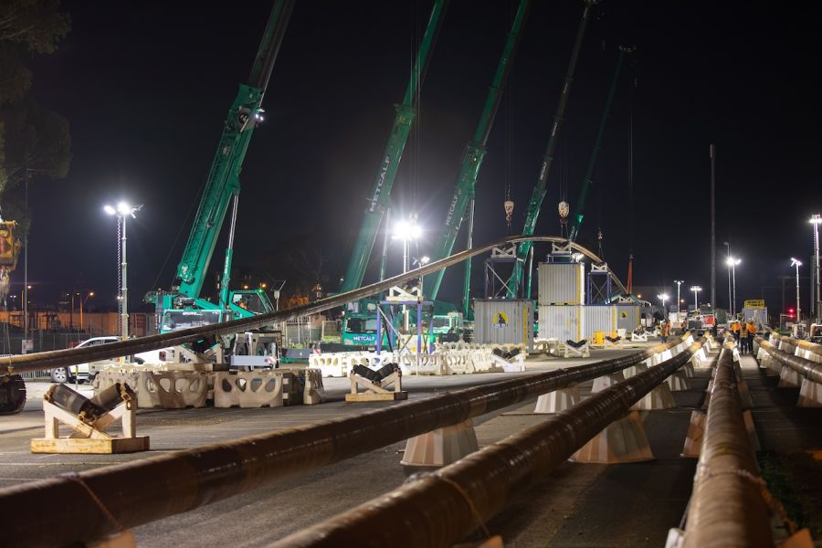Five cranes worked in tandem to lift sections of the pipe