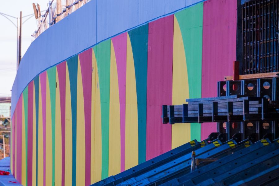 Colours such as Fern Green, Homebush Yellow, Waratah and Tangerine feature on the underpass walls