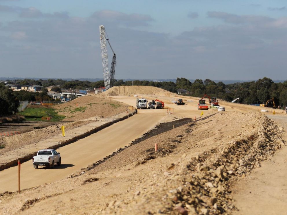 Continuing to build the Freeway between Governor Road and Bowen Parkway