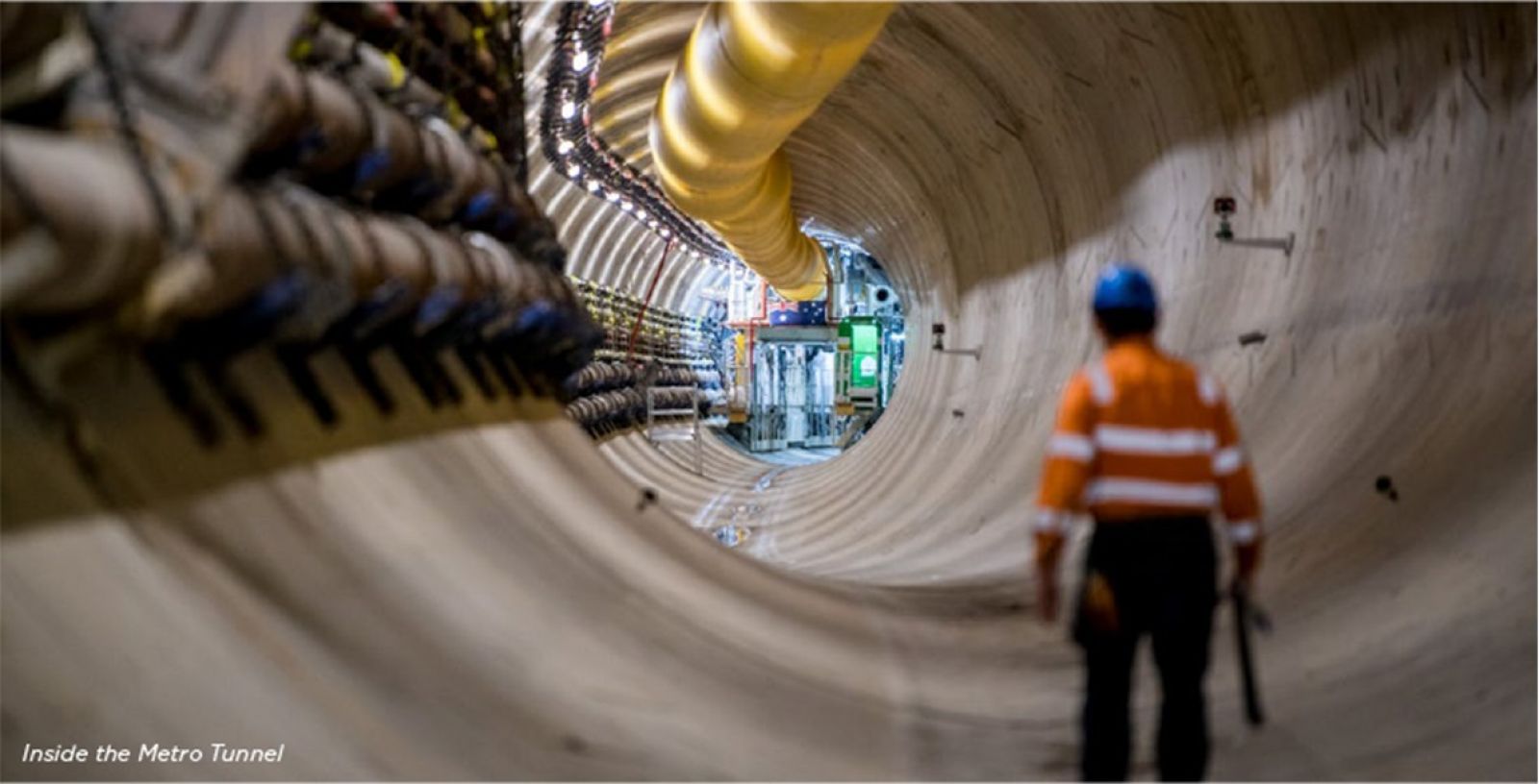 Worker walking inside the Metro Tunnel