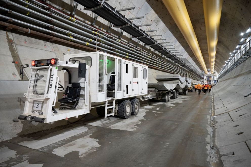 A tractor carrying concrete segments for the tunnel lining.